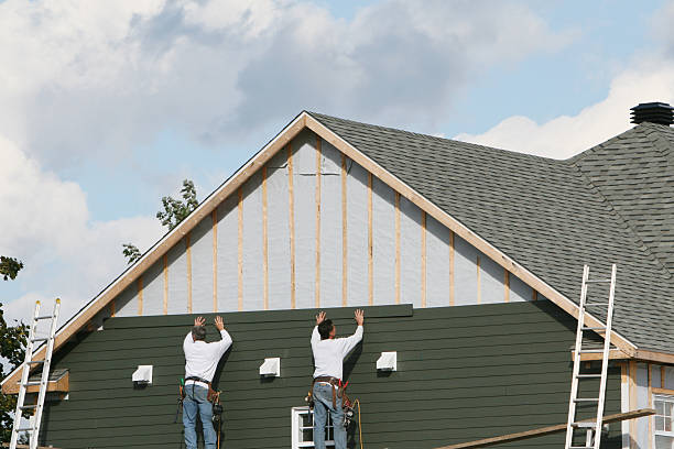 Professional Emergency Siding Repair technician working in Wharton, OH